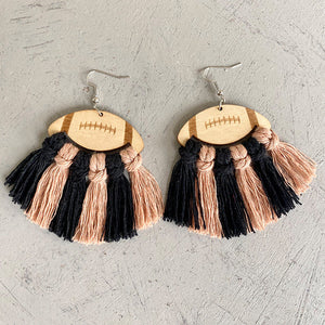 Macrame football tassel earrings in black and peach with wood detail.