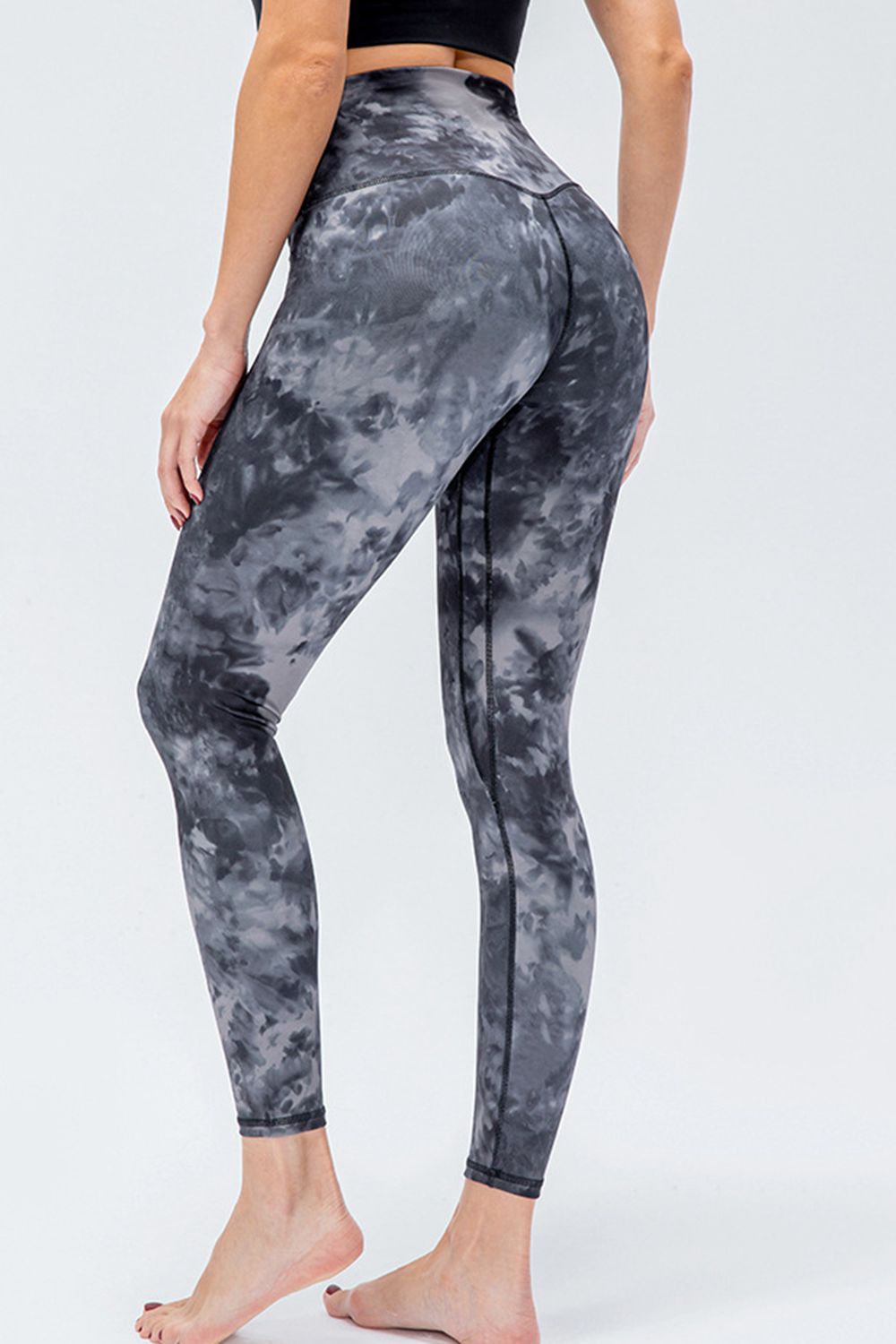 Sculpted high-rise performance leggings in dark gray tie-dye pattern.
