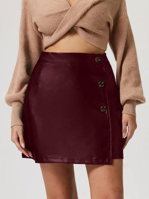 Burgundy faux leather asymmetric button-front mini skirt with button detail