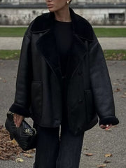 Black oversized aviator jacket with shearling trim and collar, buttoned front, and cuffed sleeves.