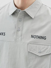 Light Gray polo shirt with button detail, collar, and chest pocket.