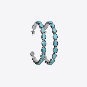 Textured turquoise stone hoop earrings with silver alloy setting.
