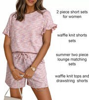Pink waffle knit two-piece set with ruffled sleeves and drawstring shorts