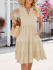 Tan ruffled midi dress with notched V-neck, flutter sleeves, elastic waist, and tiered skirt.