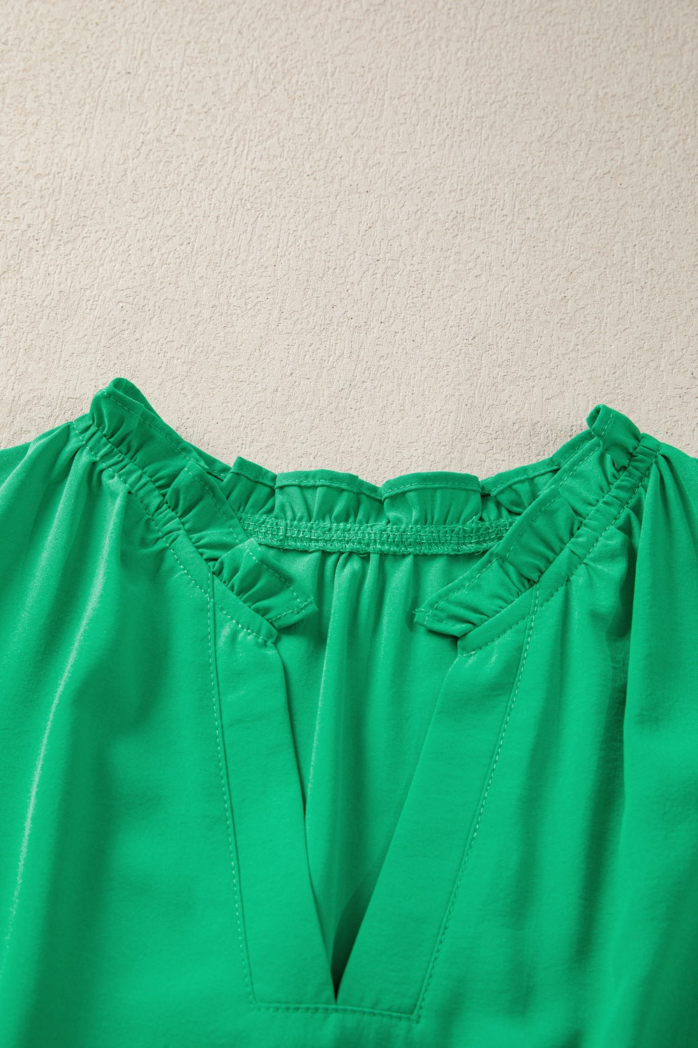 Green maxi dress with ruffled neckline and V-neck detail