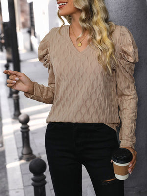 Mocha knit sweater with wave stitch pattern, V-neck and puff sleeves.