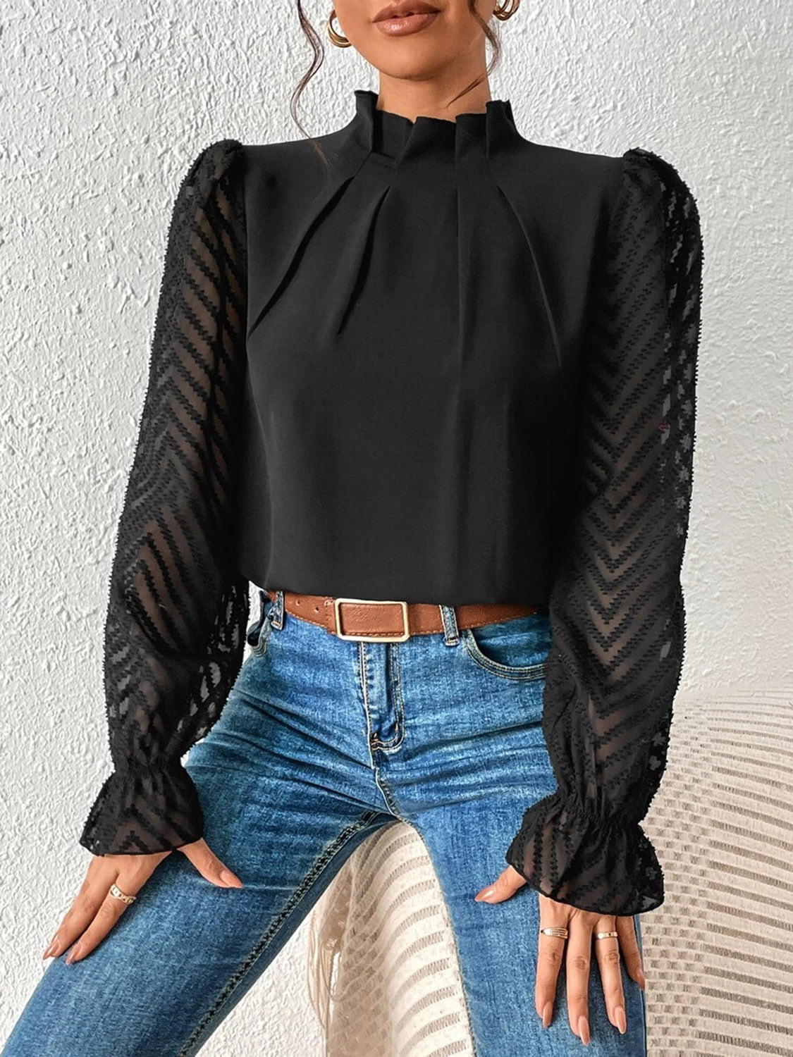 Black chevron sleeve ruffle neck blouse with sheer sleeves.