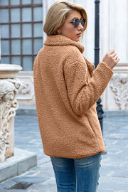 Camel teddy pea coat with a double-breasted closure and notched lapels.