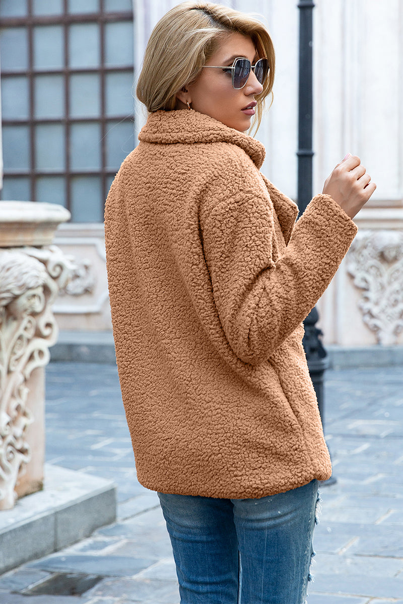 Camel teddy pea coat with a double-breasted closure and notched lapels.