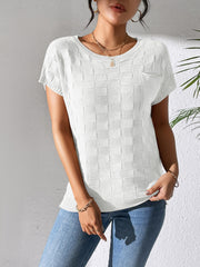 White knit pocket tee with textured check pattern and short sleeves