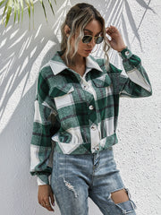 Cropped green plaid shacket with button front and patch pockets.