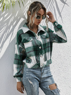 Cropped green plaid shacket with button front and patch pockets.