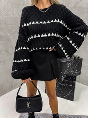 Black textured knit sweater with white stripe pattern and balloon sleeves