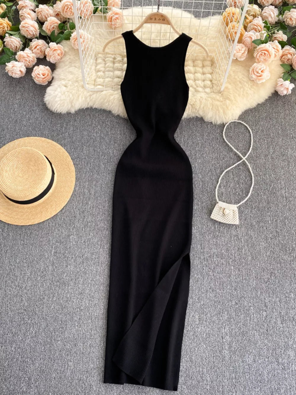 Black ribbed knit midi dress with cutout back and side slit.