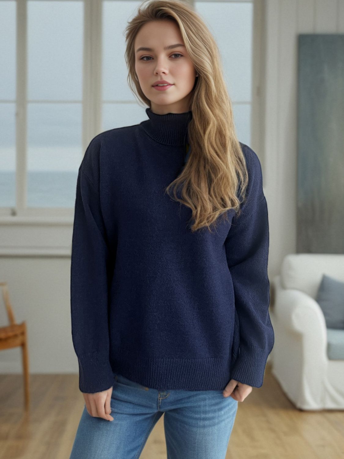 Dark blue relaxed fit turtleneck sweater with ribbed cuffs and hem, acrylic blend.