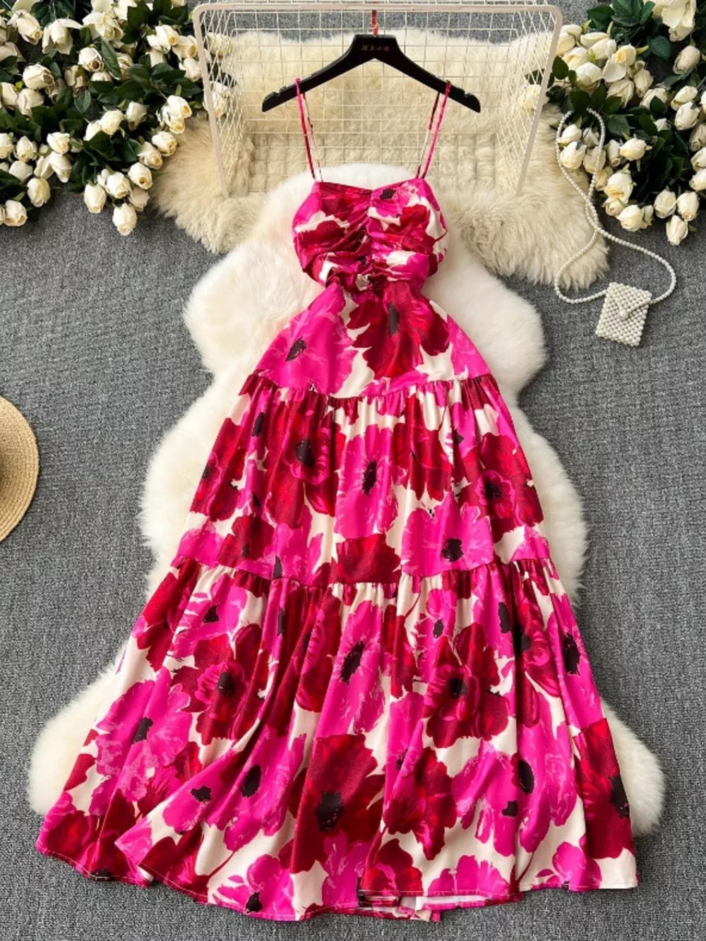 Vibrant floral tiered cami maternity swim dress with cutout detail and ruched bodice.