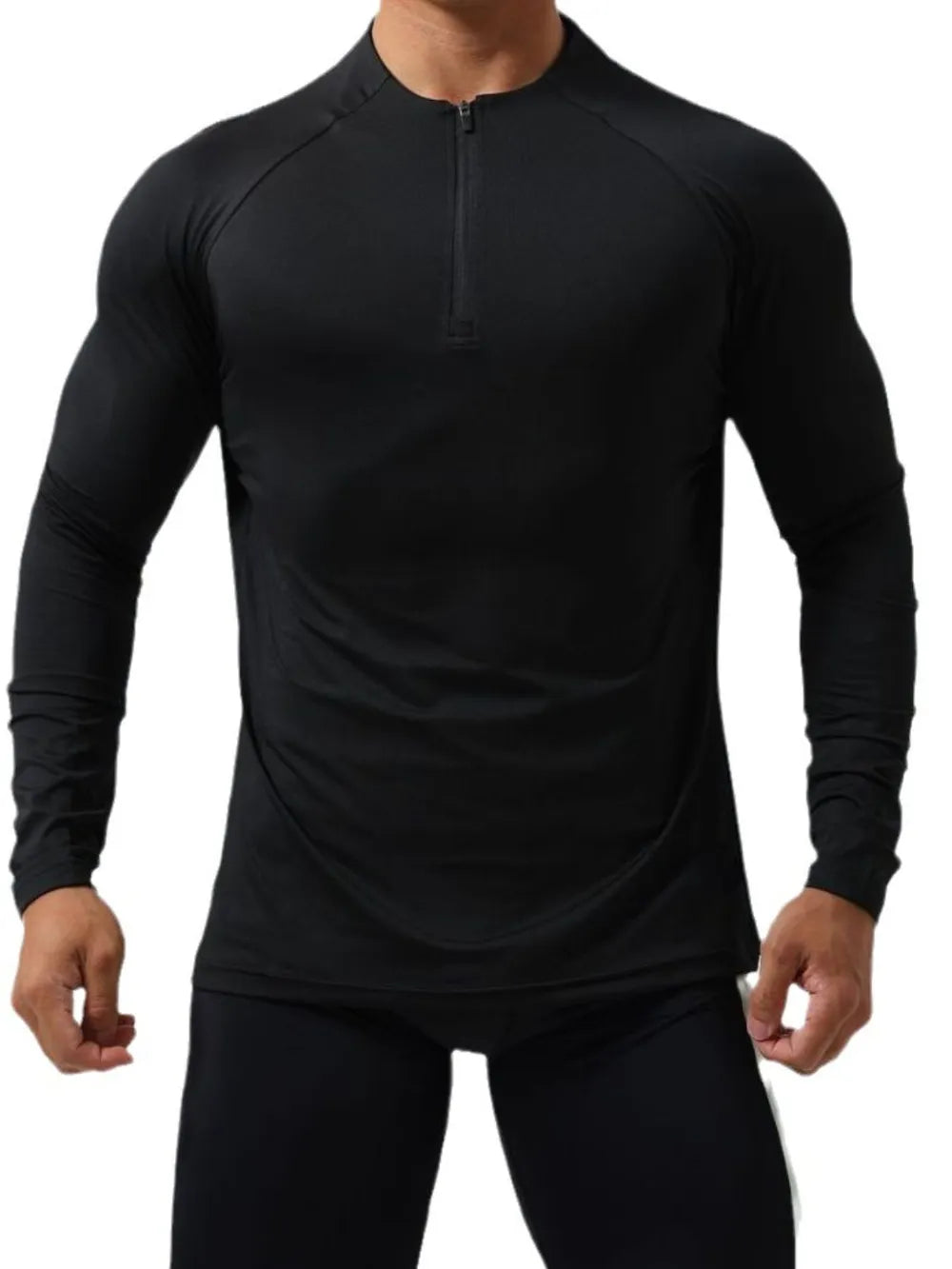Black performance raglan zip-neck active top with long sleeves.
