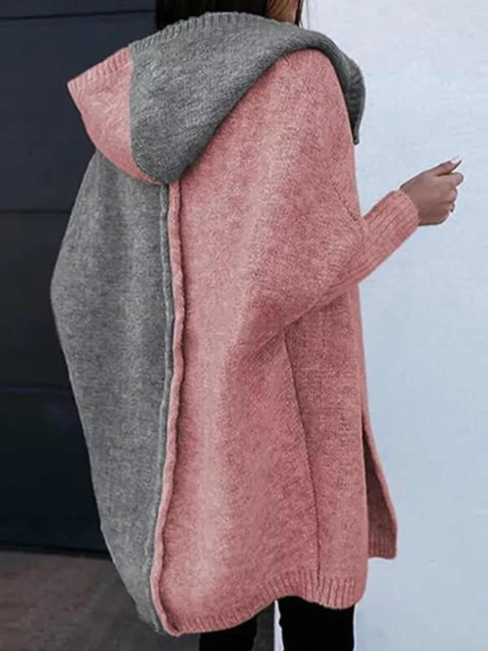 Two-tone hooded knit cardigan in dusty pink and gray acrylic with side slits.