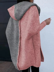 Two-tone hooded knit cardigan in dusty pink and gray acrylic with side slits.