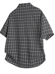Black plaid oversized button-front shirt with short sleeves.