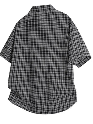 Black plaid oversized button-front shirt with short sleeves.