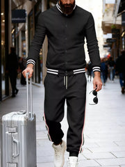 Black men's track pants with white and red side stripes and drawstring.