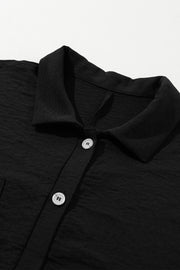 Black oversized shirt romper with collar and button detail