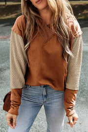Hoodie with textured sleeves in caramel and tan colorblock, V-neck detail