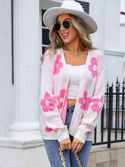 Blush pink acrylic intarsia knit cardigan with a floral pattern and open front.
