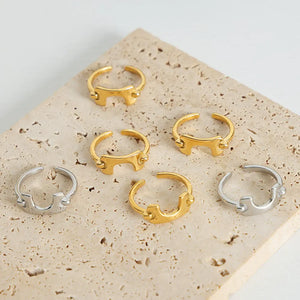 Sculptural gold and silver open-ended rings with unique asymmetrical design.
