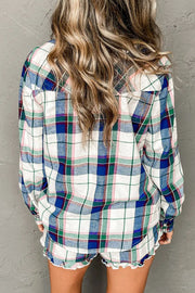 Plaid pajama set with ruffled hem shorts and long sleeve top.