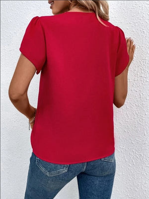 Red flutter sleeve blouse with lace trim detail.