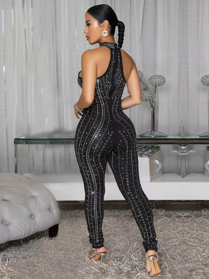 Black rhinestone halter neck romper with full length legs and allover sparkle detail.