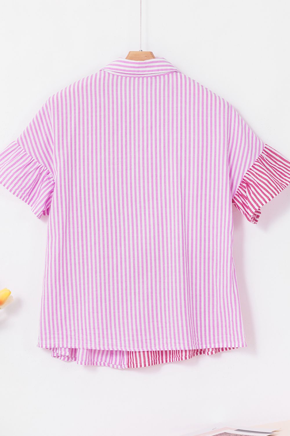 Pink striped blouse with ruffle sleeves and buttoned collar