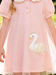 Charming blush pink cotton baby dress with Peter Pan collar and swan appliqué