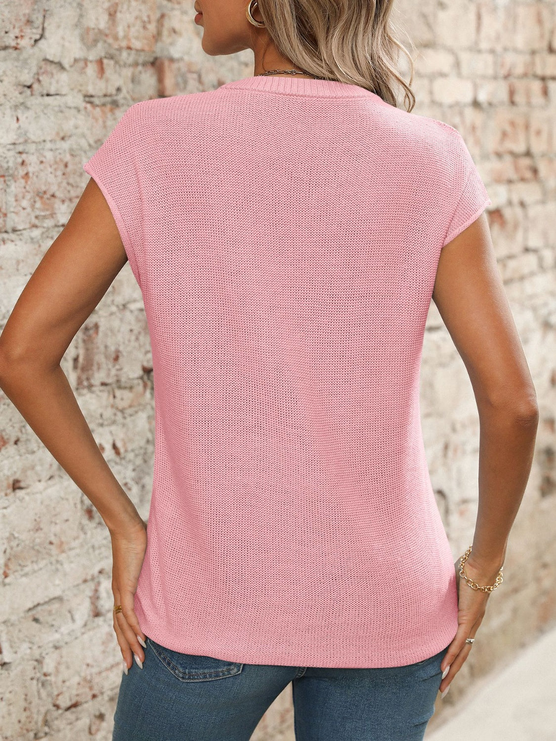 Seamed knit sleeveless blush pink V-neck top with a casual fit.