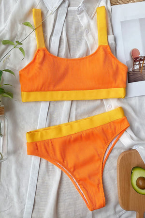 Ribbed orange high-waist bikini set with yellow trim and straps.