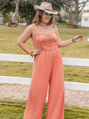 Orange wide leg jumpsuit with embroidered bodice and spaghetti straps