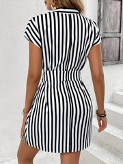 Black and white striped mini dress with self-tie waist and short sleeves.