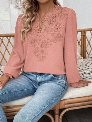 Pink purple embroidered yoke blouse with puff sleeves and textured fabric.