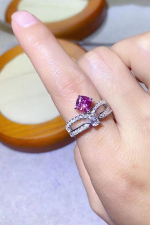 Pink moissanite bow ring with pavé detail on sterling silver band