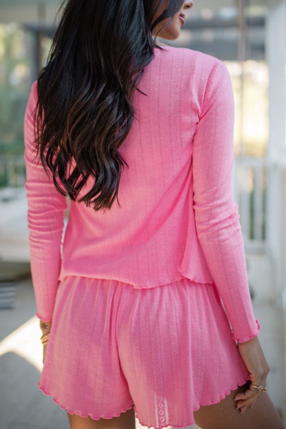 Fuchsia pink knit lounge set with lace trim and scalloped hem shorts.