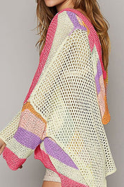 Colorblock knit hoodie with open weave and striped details in pink, purple, and orange.