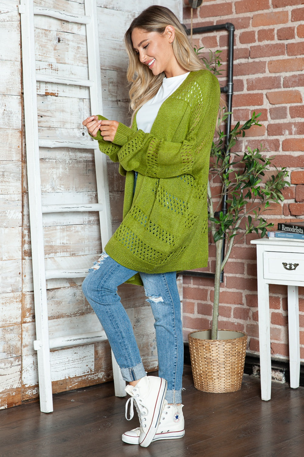 Open-knit slouchy cardigan in matcha green with a relaxed fit and open front.
