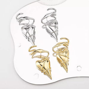 Twisted heart wire earrings in silver and gold luxe finish with unique sculptural detail.