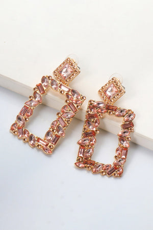 Geometric jewel box earrings in peach with gold alloy setting and sparkling stones.