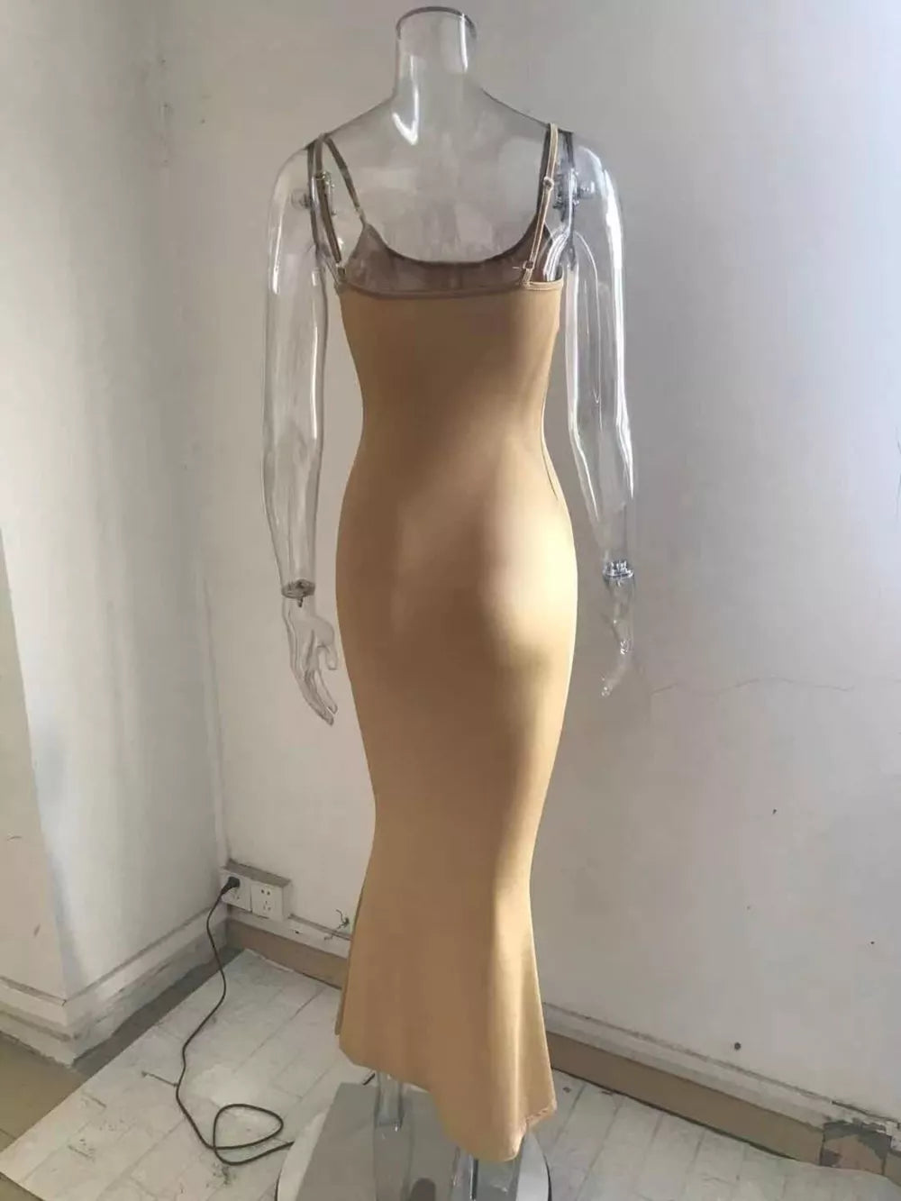 Camel spaghetti strap bodycon maxi dress with a mermaid hem.