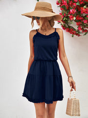 Dark blue ruffled camisole tiered mini dress with elastic waist and ruffled hem.