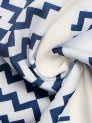 Geometric striped strapless wide-leg romper in navy and white fabric detail