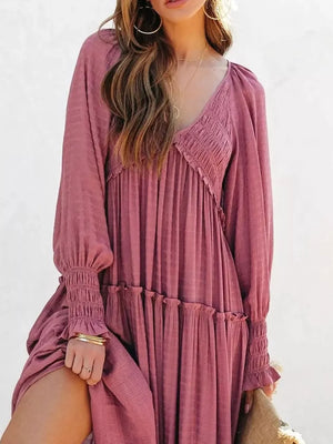 Smocked V-neck tiered maxi dress in Dark Pink with long sleeves and ruffled hem.